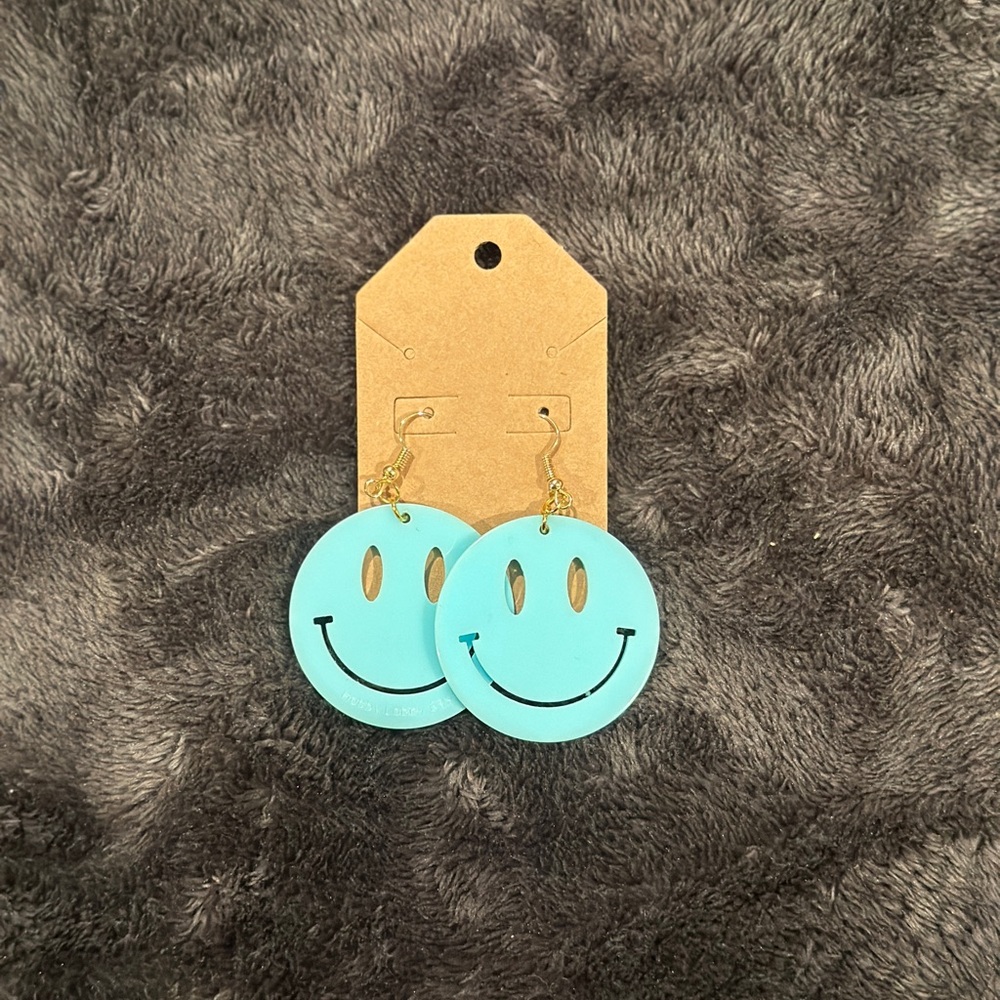 Smiley face ear rings, new